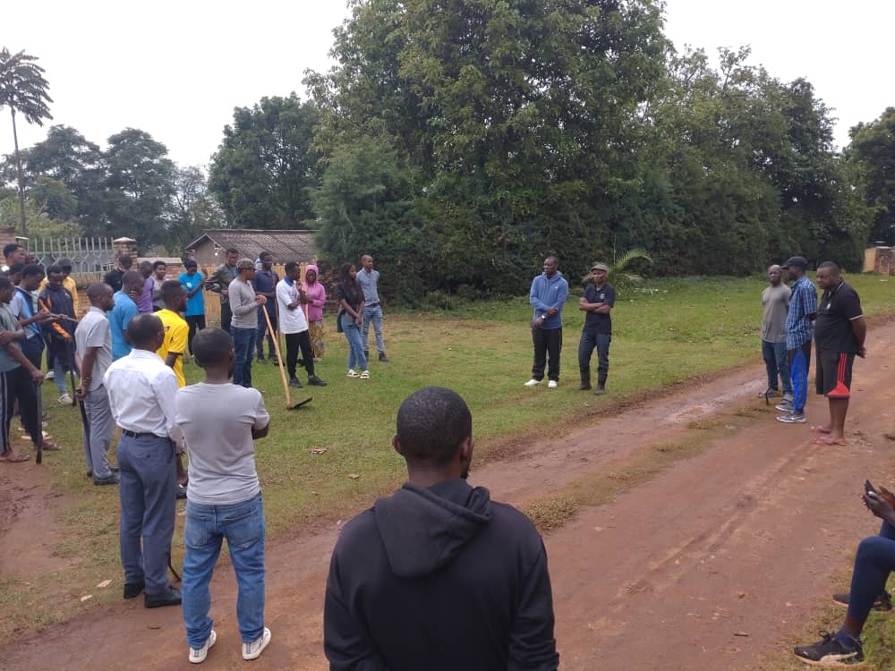 Moses with students in rural community
